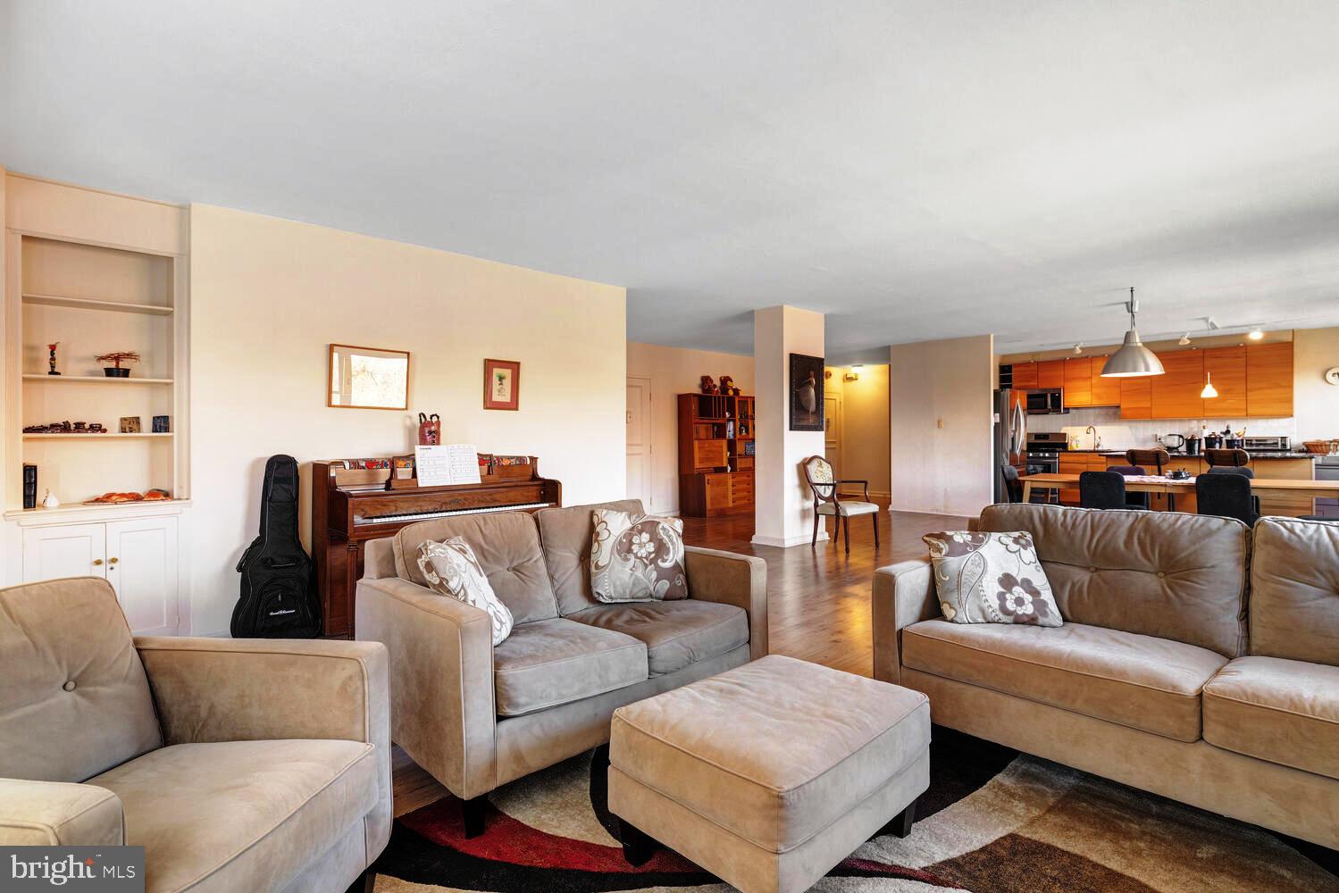7900 Old York Road, Unit 907A Elkins Park, PA 19027 - Photo 16 of 36 a living room with furniture and a couch