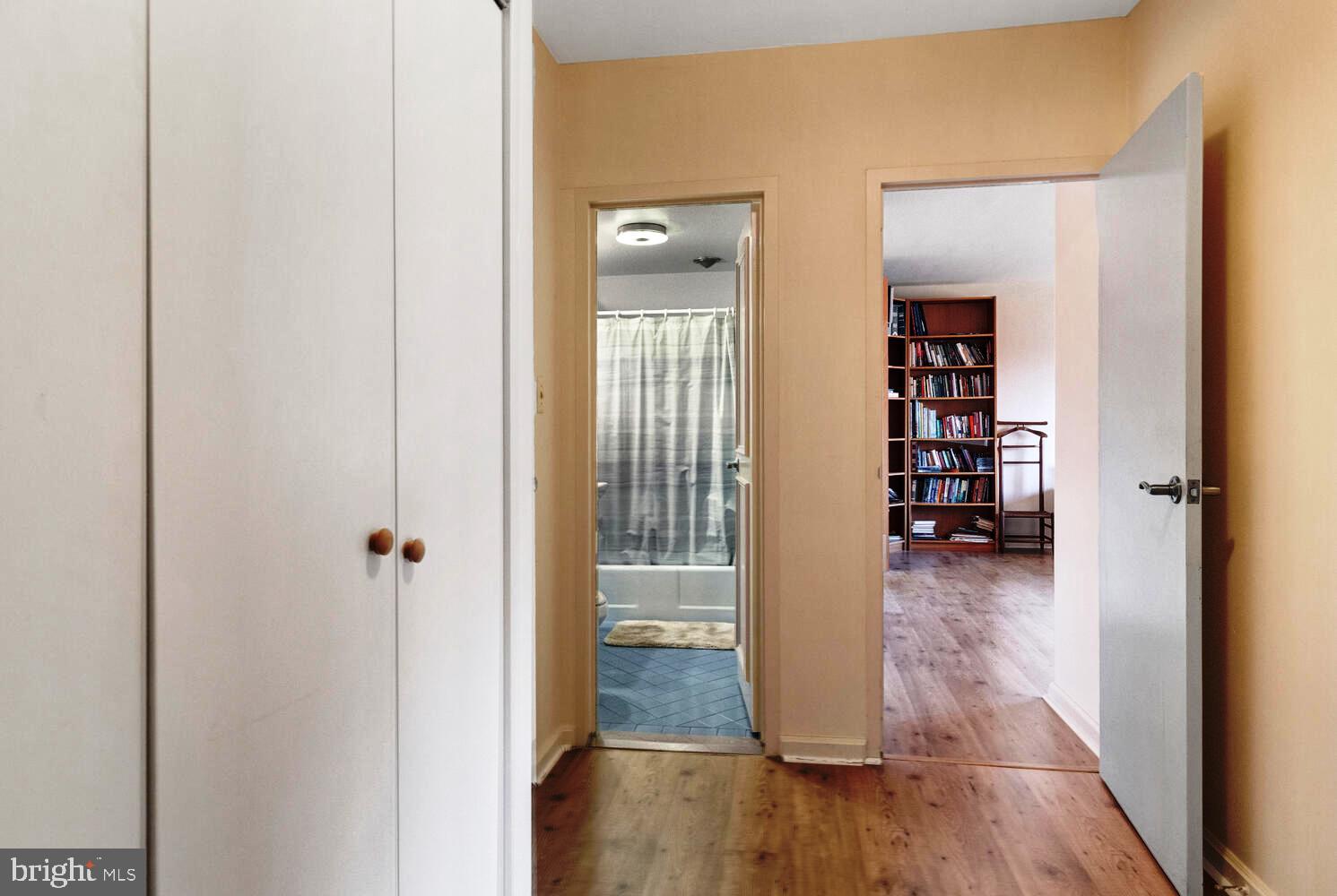 7900 Old York Road, Unit 907A Elkins Park, PA 19027 - Photo 21 of 36 a view of a hallway with wooden floor and a living room