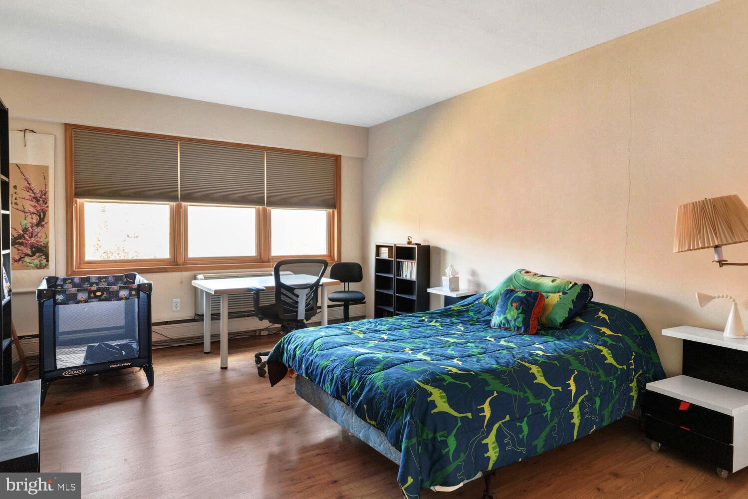 7900 Old York Road, Unit 907A Elkins Park, PA 19027 - Photo 23 of 36 a bedroom with a bed and a large window