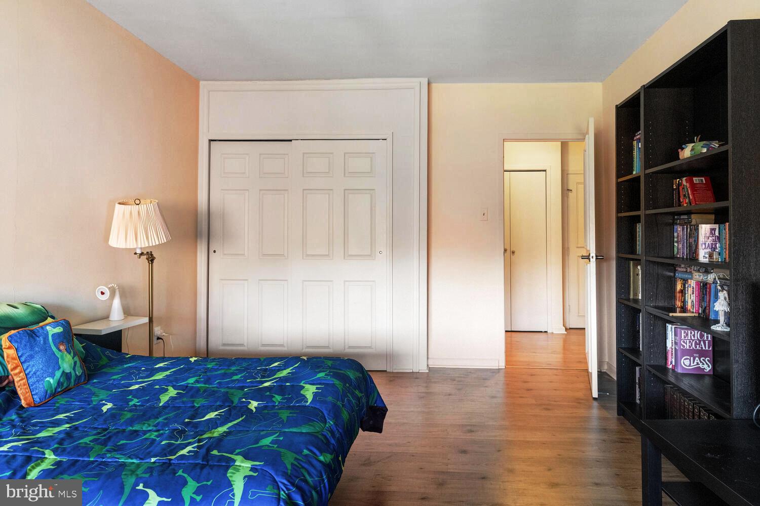 7900 Old York Road, Unit 907A Elkins Park, PA 19027 - Photo 24 of 36 a bedroom with a bed and a bookshelf