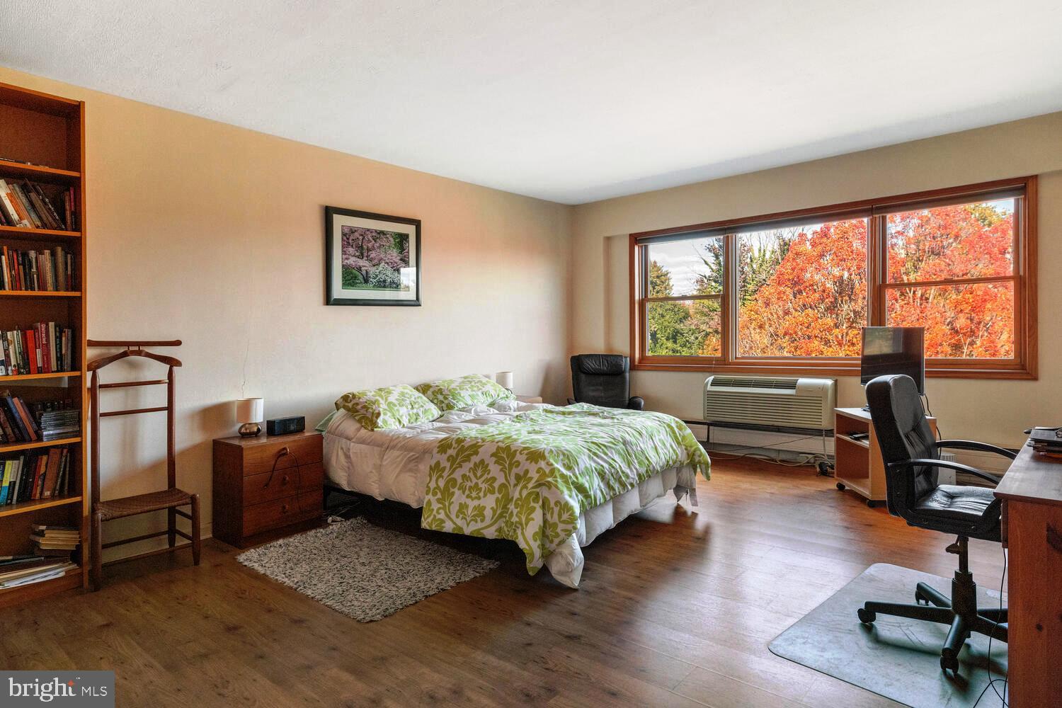 7900 Old York Road, Unit 907A Elkins Park, PA 19027 - Photo 26 of 36 a bedroom with a bed and a large window