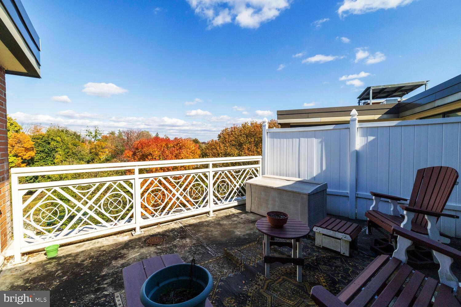 7900 Old York Road, Unit 907A Elkins Park, PA 19027 - Photo 28 of 36 a view of a patio with table and chairs