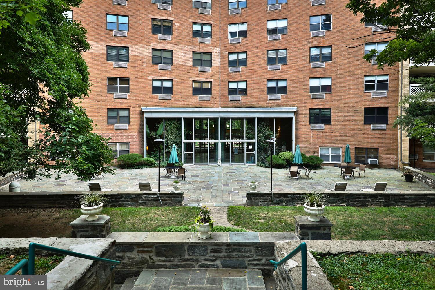 7900 Old York Road, Unit 907A Elkins Park, PA 19027 - Photo 32 of 36 a view of house with backyard and outdoor seating