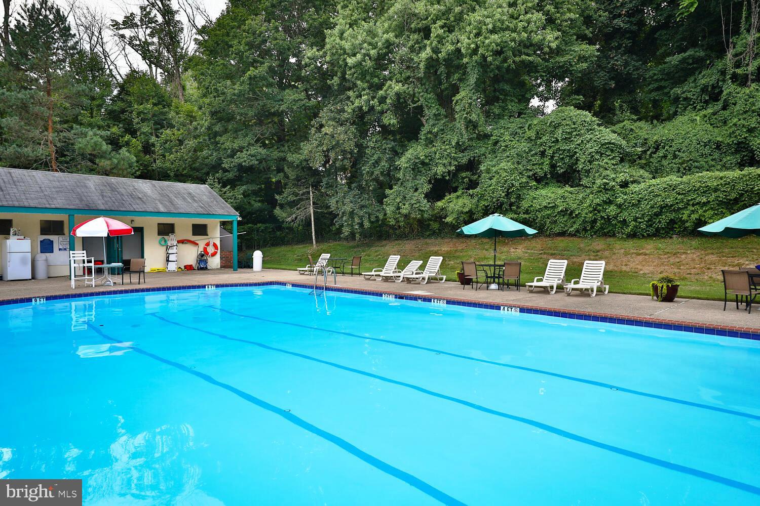 7900 Old York Road, Unit 907A Elkins Park, PA 19027 - Photo 34 of 36 an aerial view of a house with swimming pool garden view and trees
