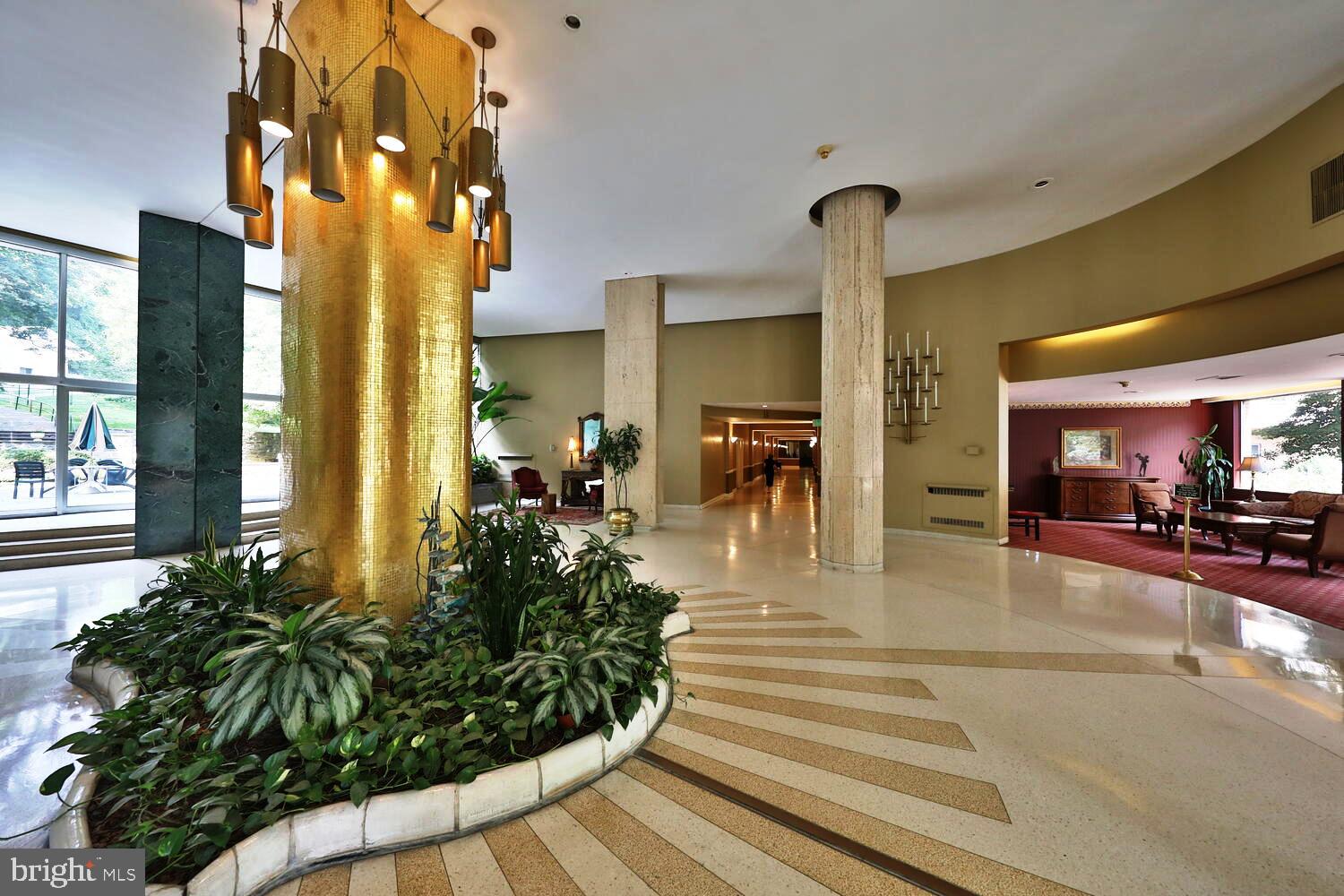 7900 Old York Road, Unit 907A Elkins Park, PA 19027 - Photo 4 of 36 a view of a lobby with furniture and floor to ceiling window