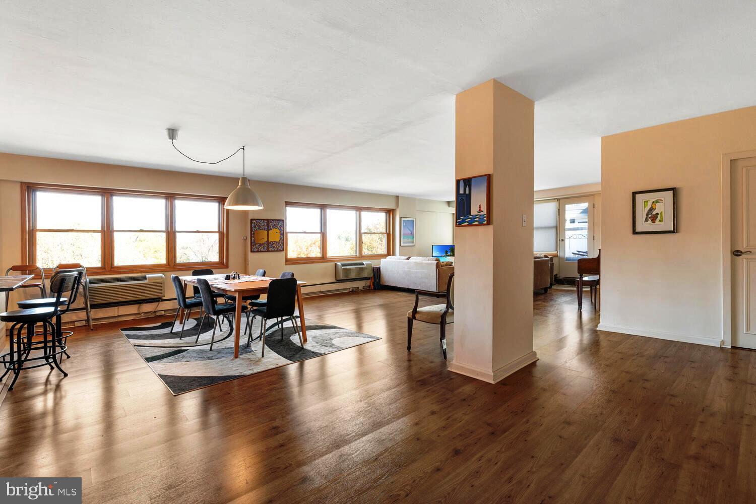 7900 Old York Road, Unit 907A Elkins Park, PA 19027 - Photo 7 of 36 a living room with fireplace furniture and a wooden floor
