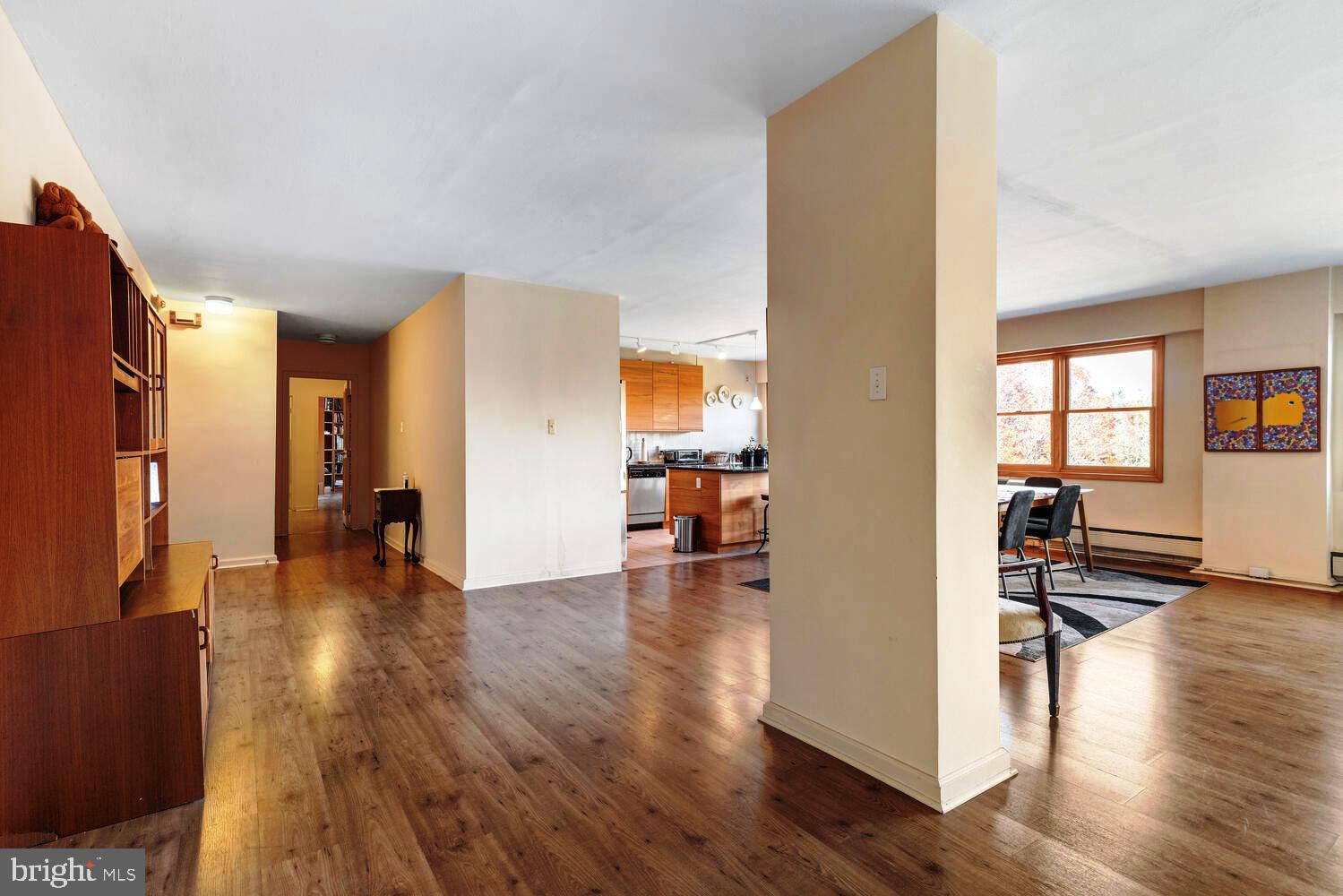 7900 Old York Road, Unit 907A Elkins Park, PA 19027 - Photo 8 of 36 a view of a living room with furniture and wooden floor