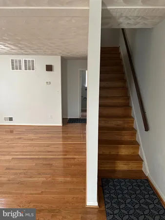 a view of entryway with wooden floor