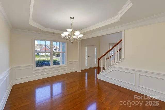 a view of an entryway with wooden floor