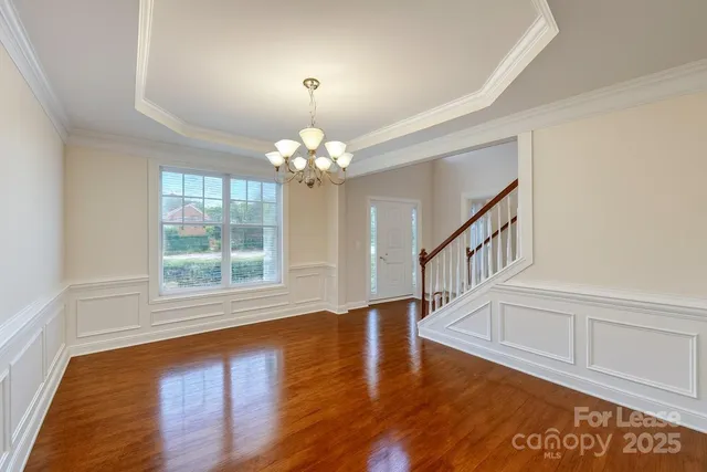 a view of an entryway with wooden floor
