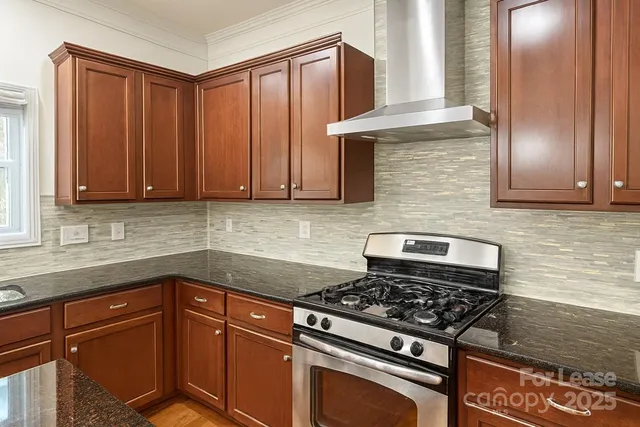 a kitchen with granite countertop cabinets and appliances