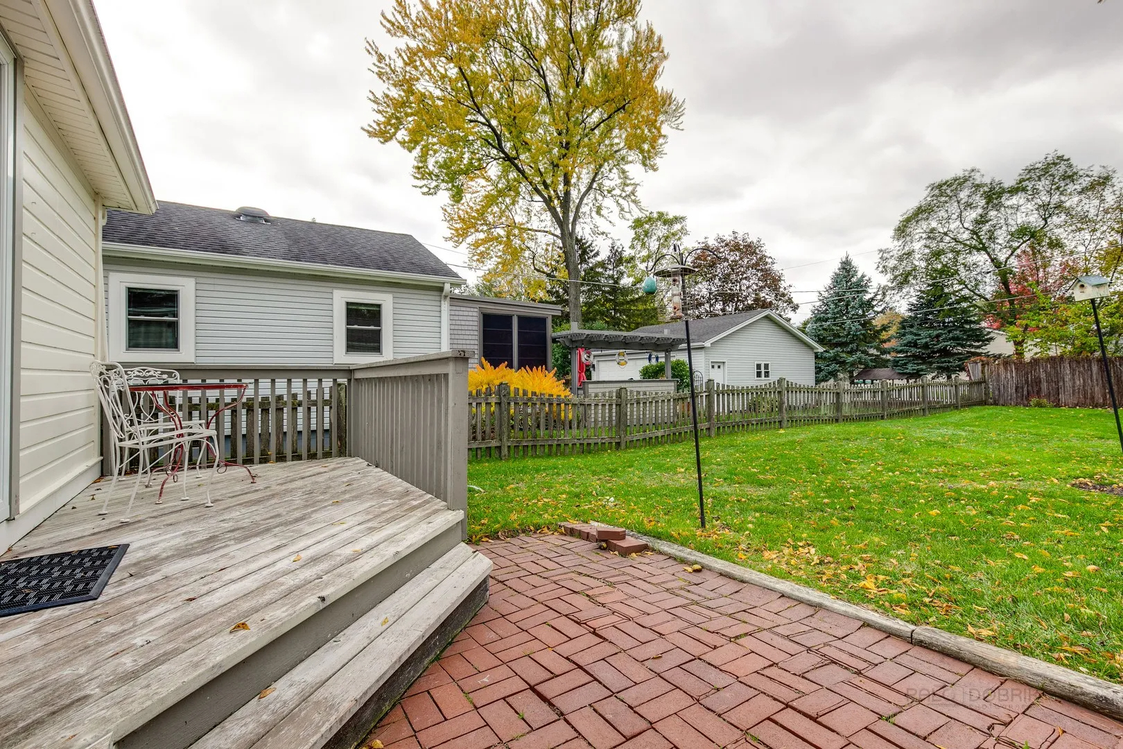 411 Foster Road Wauconda, IL 60084 - Photo 19 of 23 a view of a house with a yard and a garden