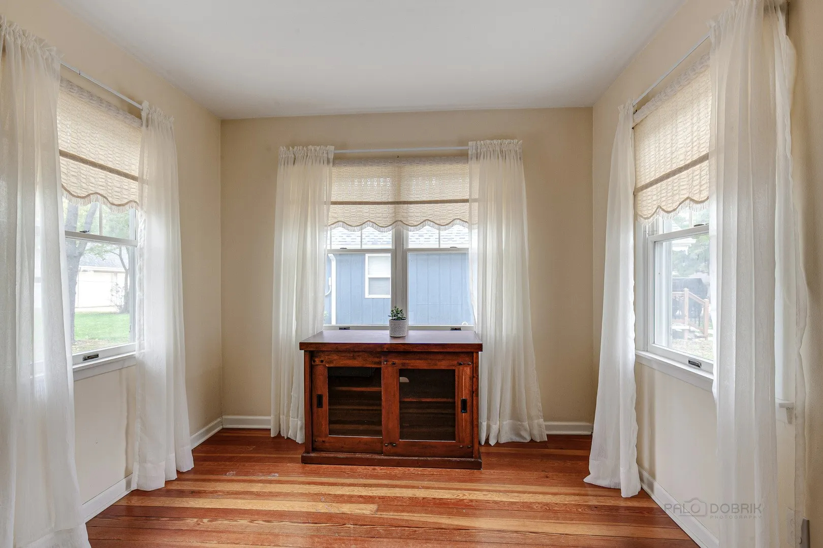 411 Foster Road Wauconda, IL 60084 - Photo 4 of 23 a view of a livingroom with wooden floor and a fireplace