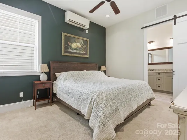 a bedroom with a bed and a table