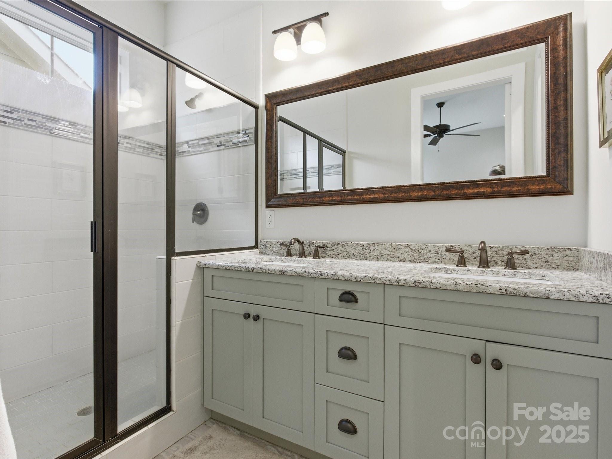 116 Meyers Ridge Road Cramerton, NC 28032 - Photo 16 of 33 a bathroom with a granite countertop sink vanity and mirror