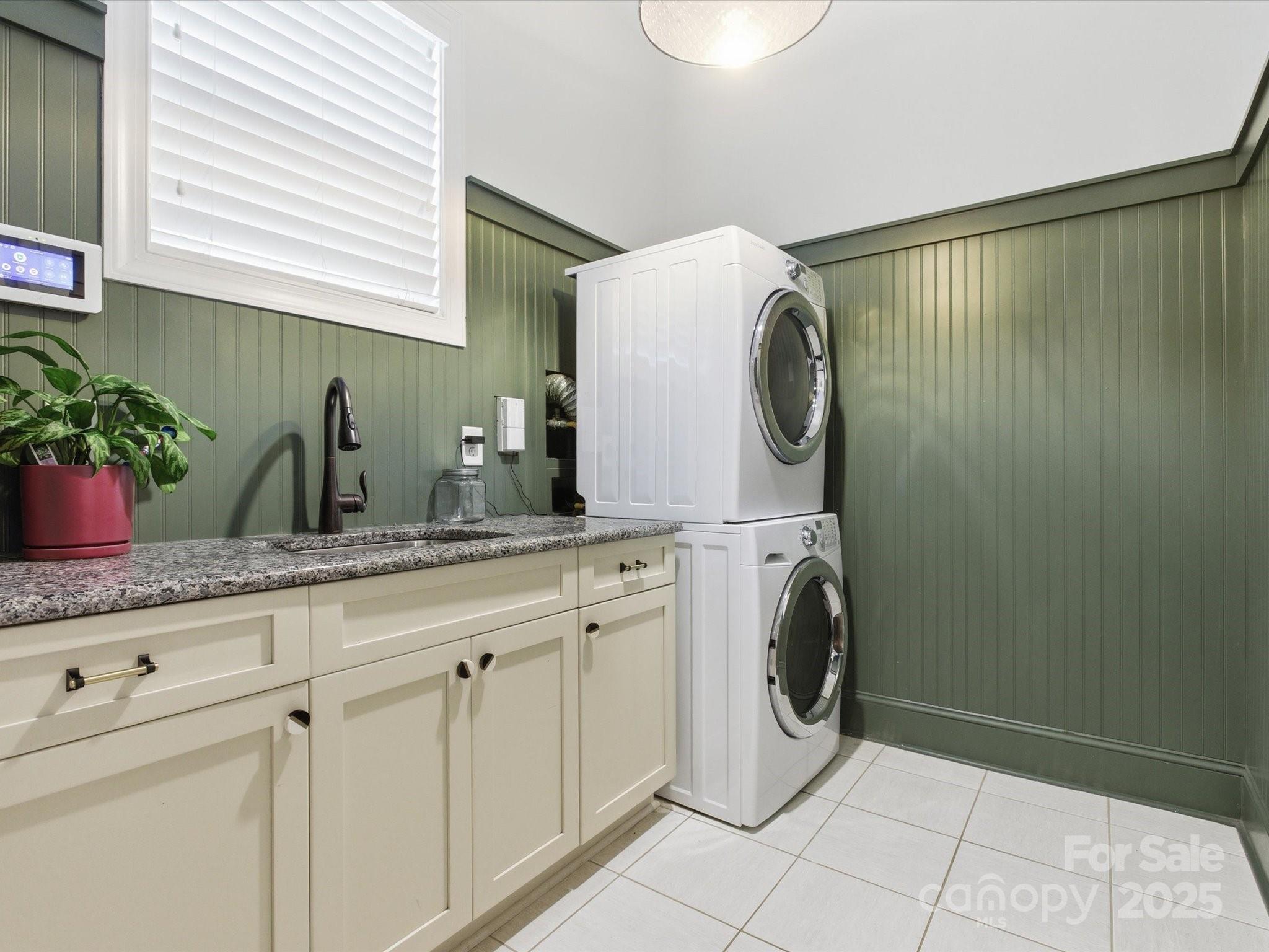 116 Meyers Ridge Road Cramerton, NC 28032 - Photo 18 of 33 a bathroom with a granite countertop sink and a washing machine