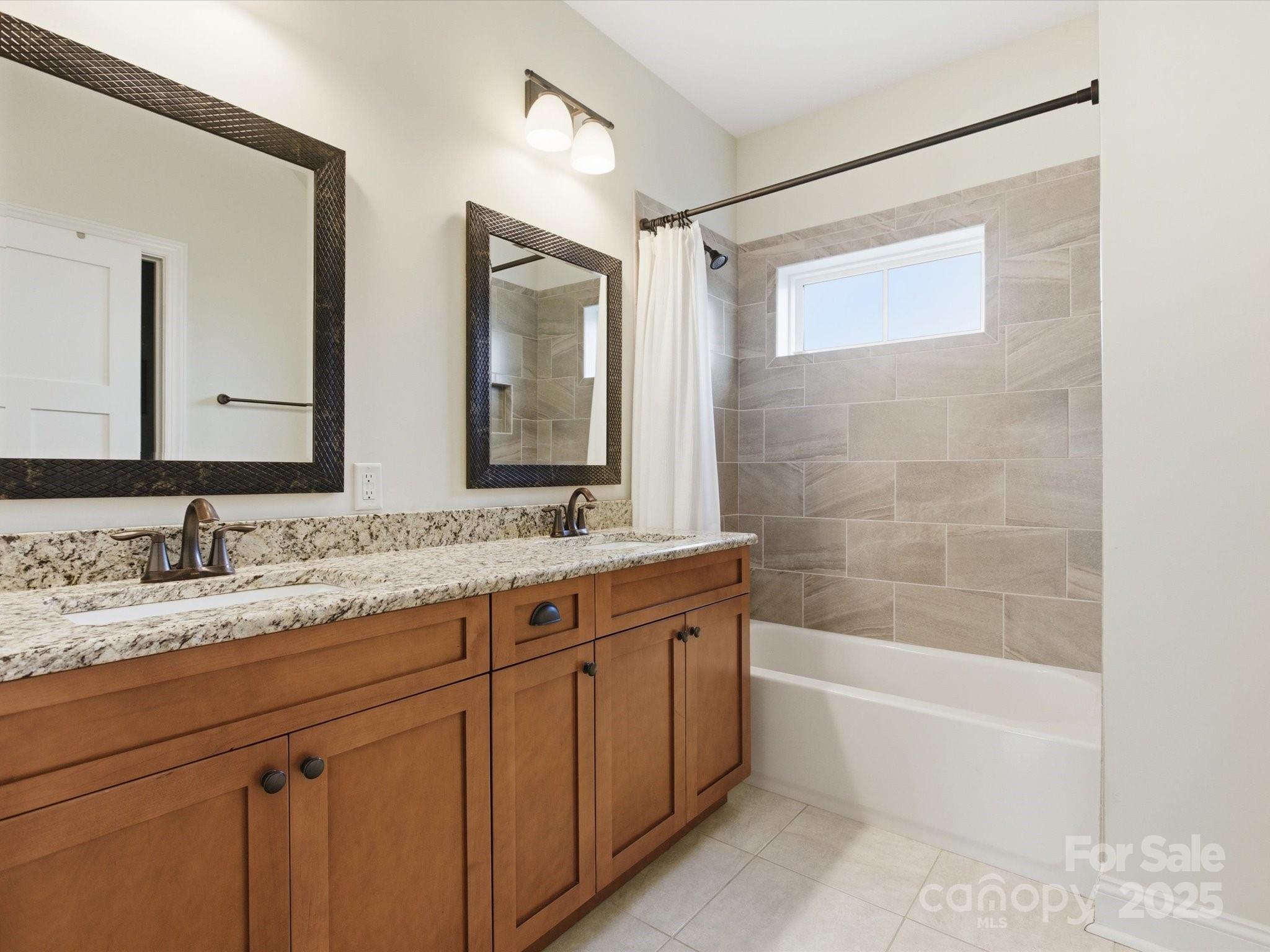 116 Meyers Ridge Road Cramerton, NC 28032 - Photo 22 of 33 a bathroom with a tub a sink and mirror