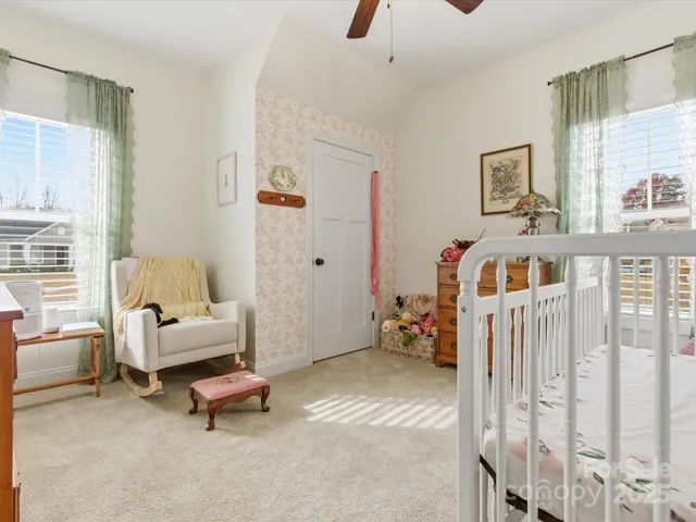 a bedroom with furniture and a window