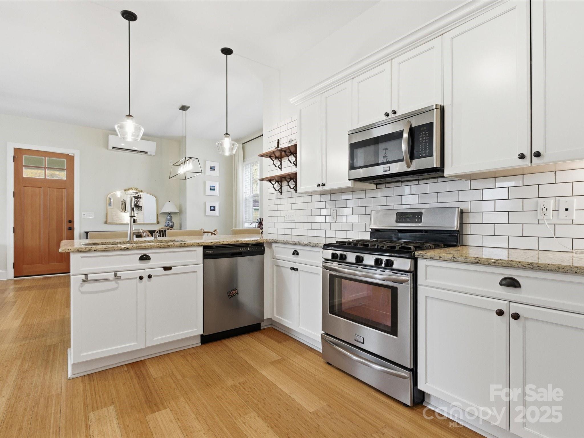 116 Meyers Ridge Road Cramerton, NC 28032 - Photo 7 of 33 a kitchen with stainless steel appliances white cabinets and a stove a sink