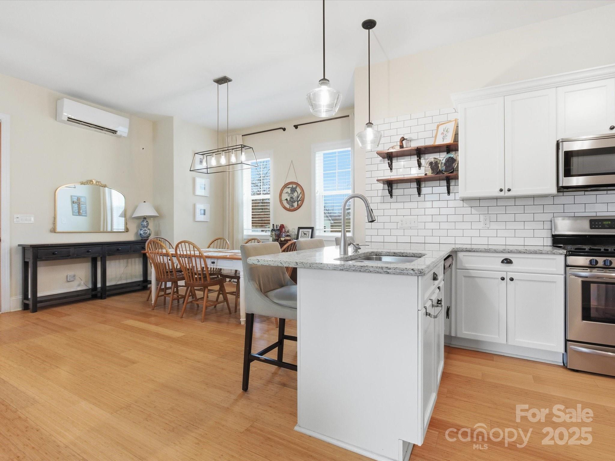 116 Meyers Ridge Road Cramerton, NC 28032 - Photo 8 of 33 a kitchen with kitchen island granite countertop a sink cabinets and stainless steel appliances
