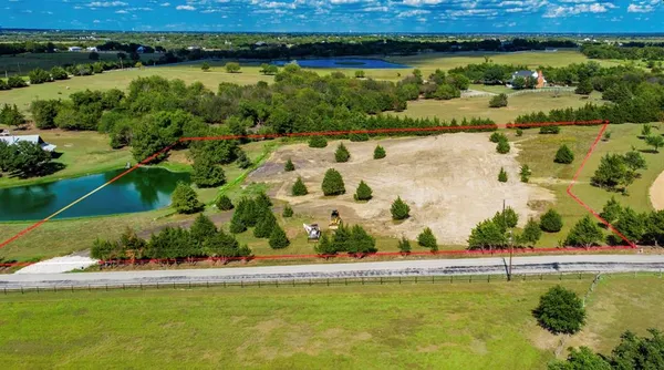 a view of a lake with a big yard