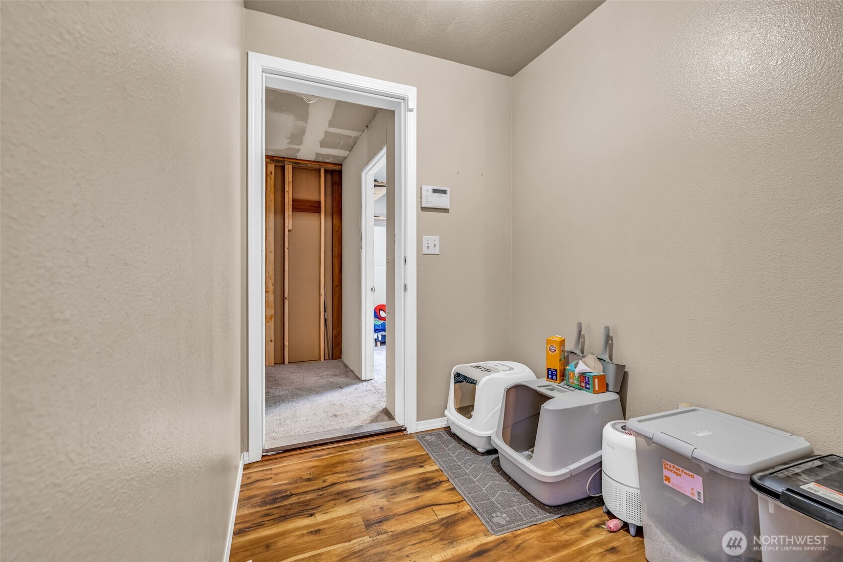 10313 School Land Road Southwest Rochester, WA 98579 - Photo 29 of 40 a bedroom with a bed and wooden floor