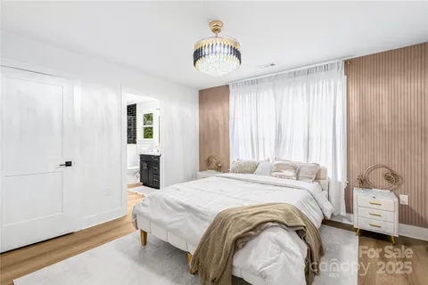 a bathroom with a double vanity sink mirror and toilet