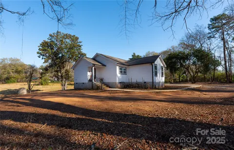 a backyard of a house with trees