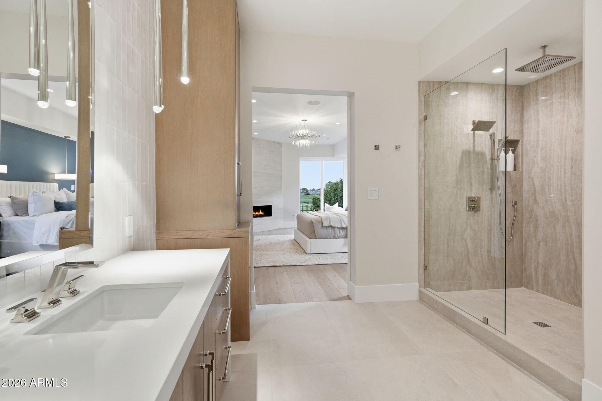 7475 East Gainey Ranch Road, Unit 7 Scottsdale, AZ 85258 - Photo 37 of 77 a bathroom with a sink a toilet and shower