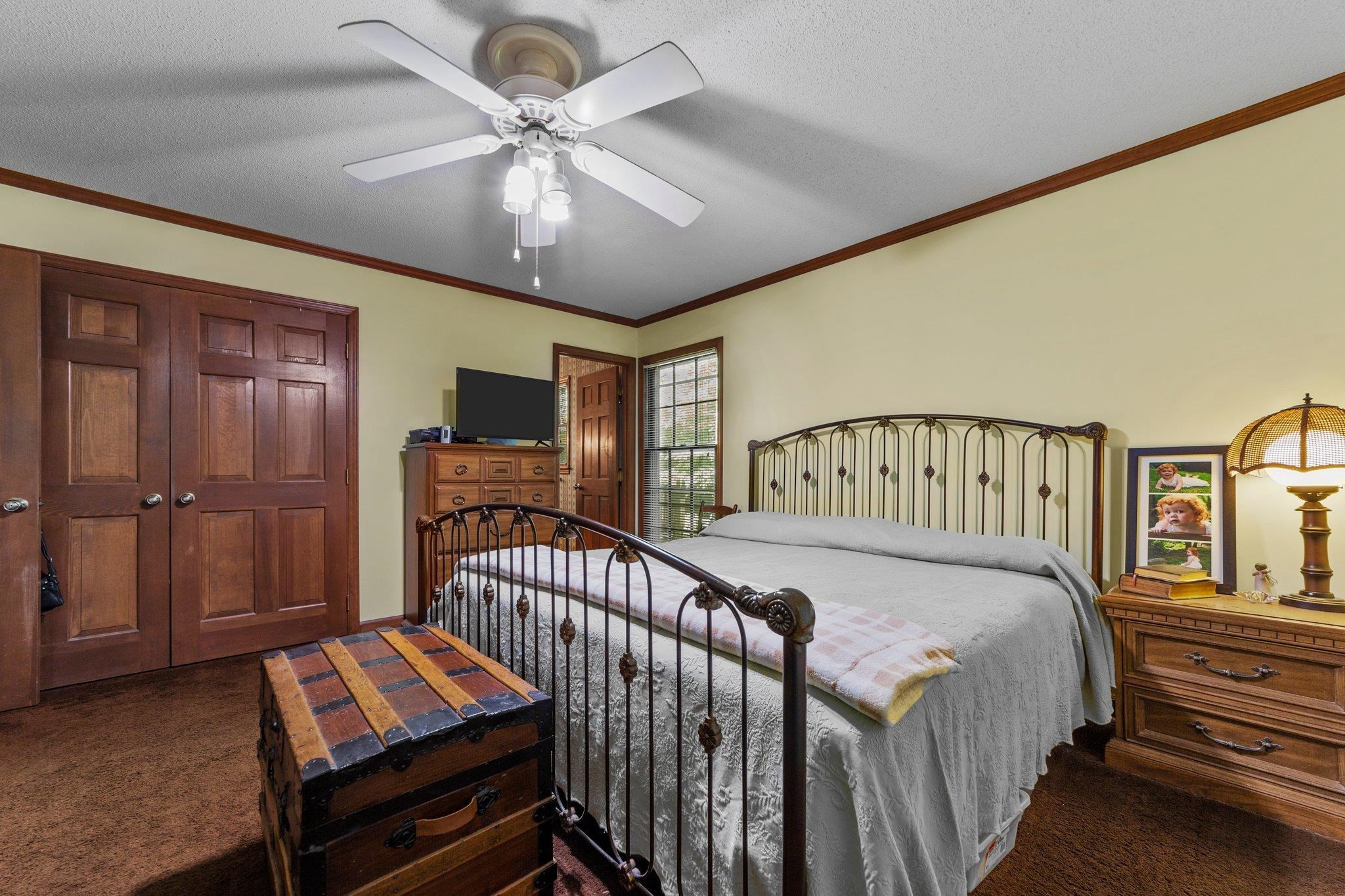 11905 Straight A Way Lane Raleigh, NC 27613 - Photo 28 of 37 a bedroom with furniture and a chandelier