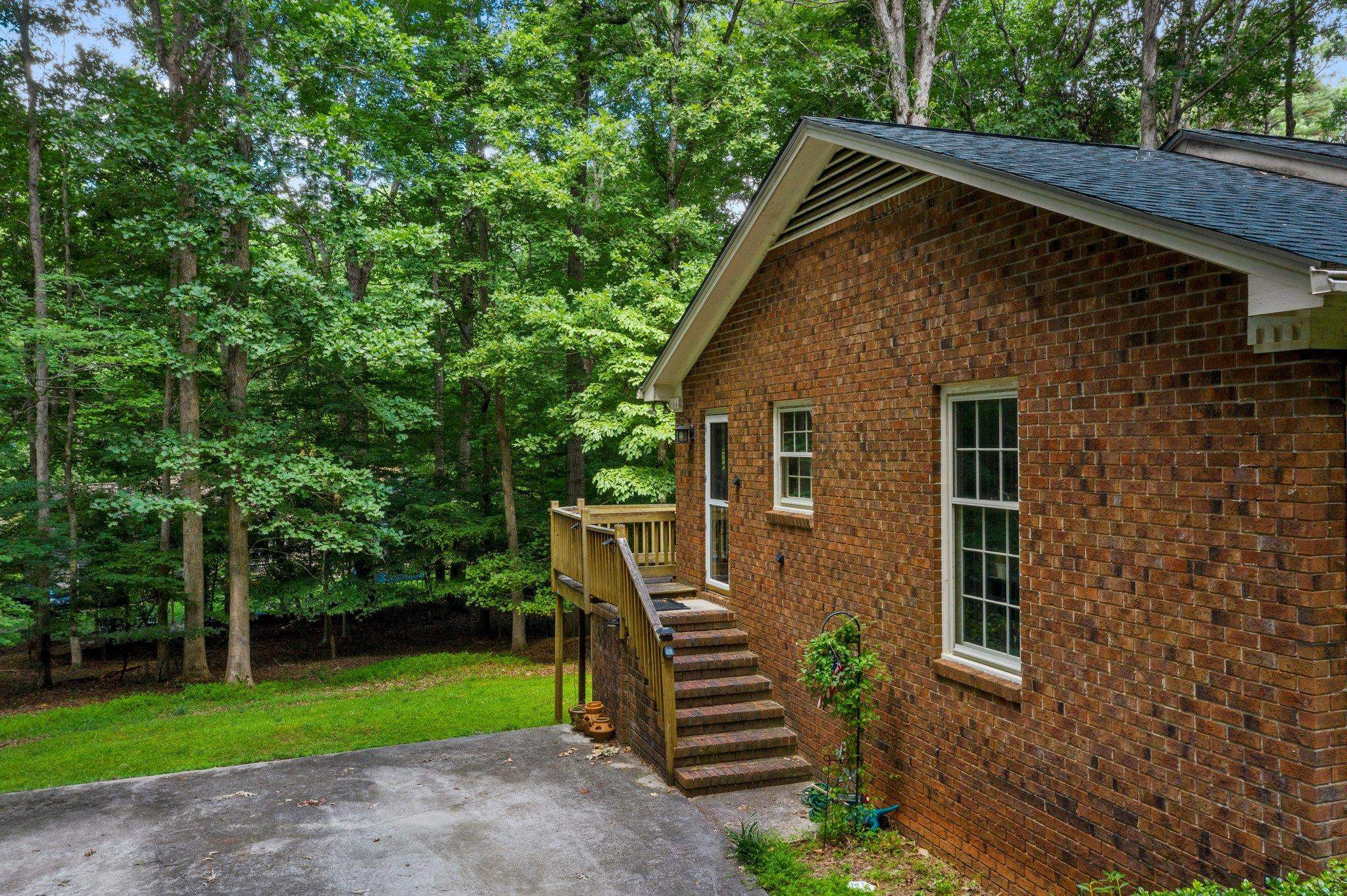 11905 Straight A Way Lane Raleigh, NC 27613 - Photo 3 of 37 a front view of a house with garden