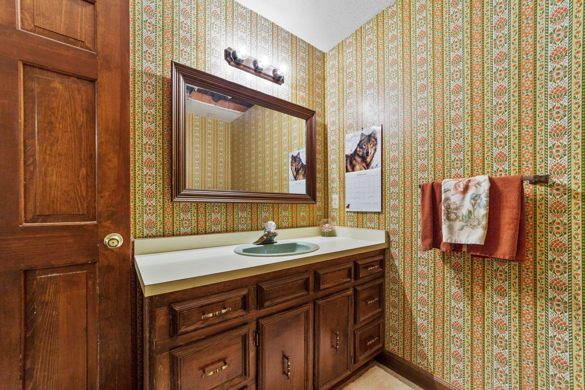 11905 Straight A Way Lane Raleigh, NC 27613 - Photo 35 of 37 a bathroom with a sink and a mirror