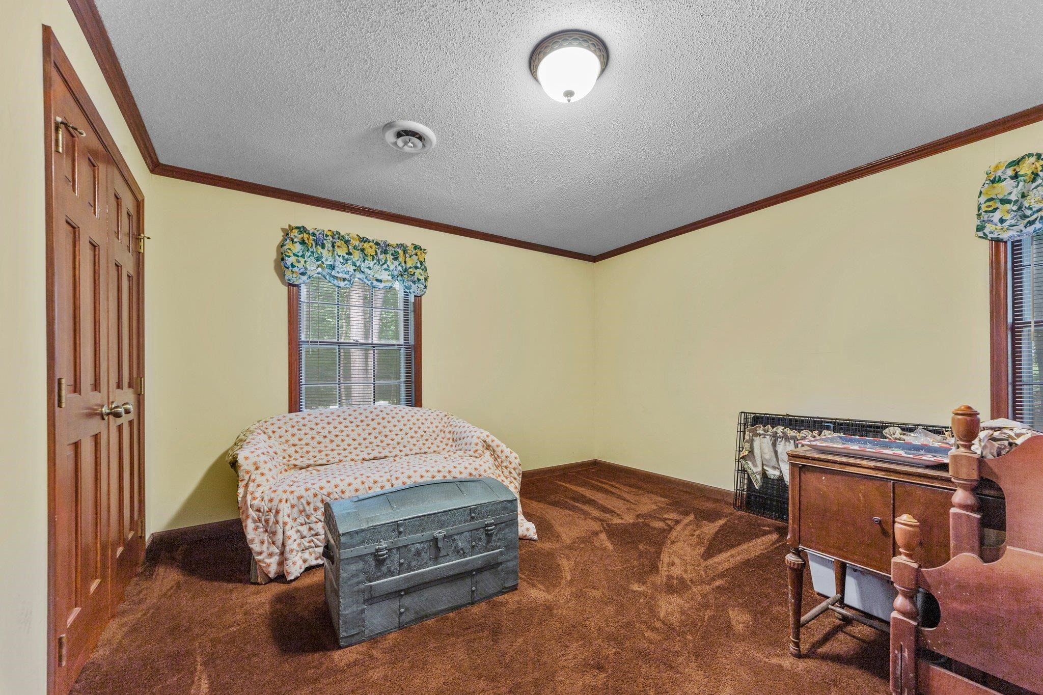 11905 Straight A Way Lane Raleigh, NC 27613 - Photo 37 of 37 a bedroom with a bed and a window