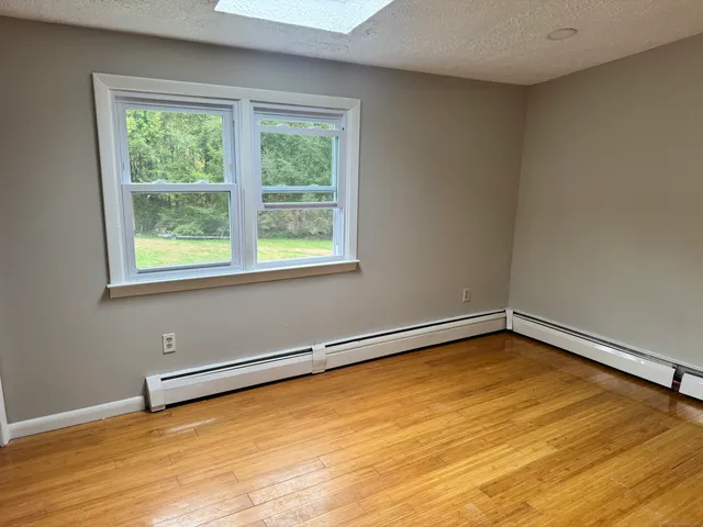 a view of a room with a large window