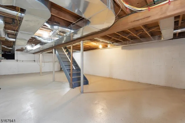 a view of an empty room with stairs