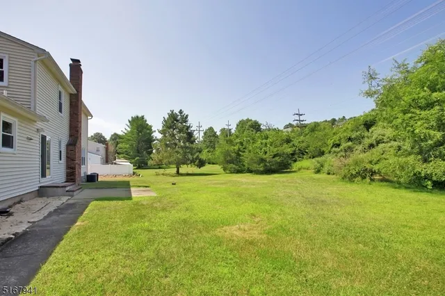 a swimming pool with trees in the background