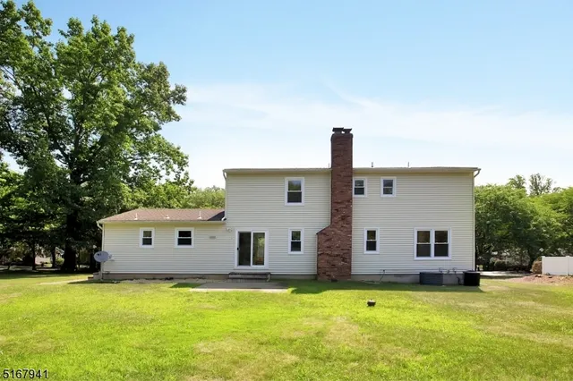 a view of a house with a big yard