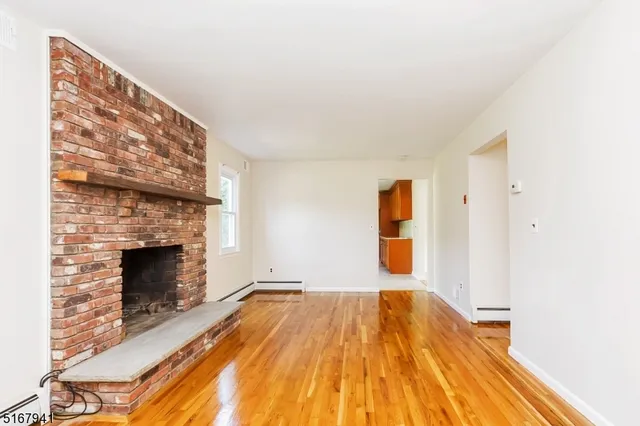a bedroom with a bed and a fireplace
