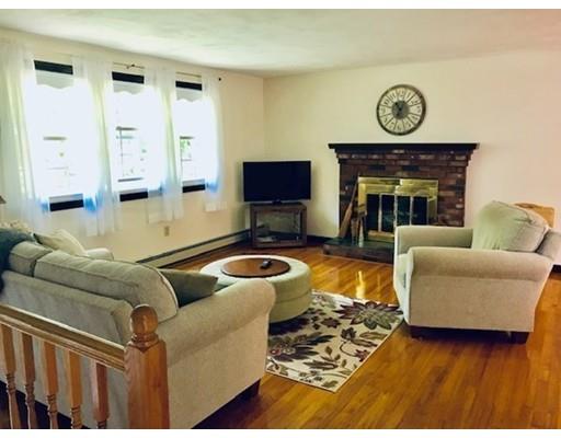 201 Beaman Road Sterling, MA 01564 - Photo 11 of 38 a living room with furniture and a fireplace