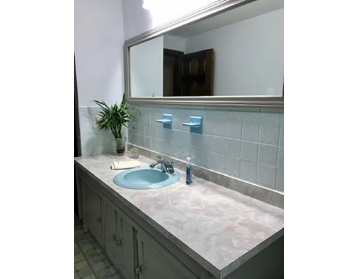 201 Beaman Road Sterling, MA 01564 - Photo 25 of 38 a bathroom with a sink and a mirror