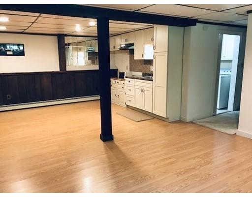201 Beaman Road Sterling, MA 01564 - Photo 29 of 38 a view of kitchen and empty room with wooden floor
