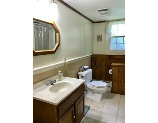 201 Beaman Road Sterling, MA 01564 - Photo 35 of 38 a bathroom with a sink toilet and mirror