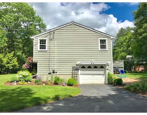 201 Beaman Road Sterling, MA 01564 - Photo 4 of 38 a front view of a house with a garden and plants