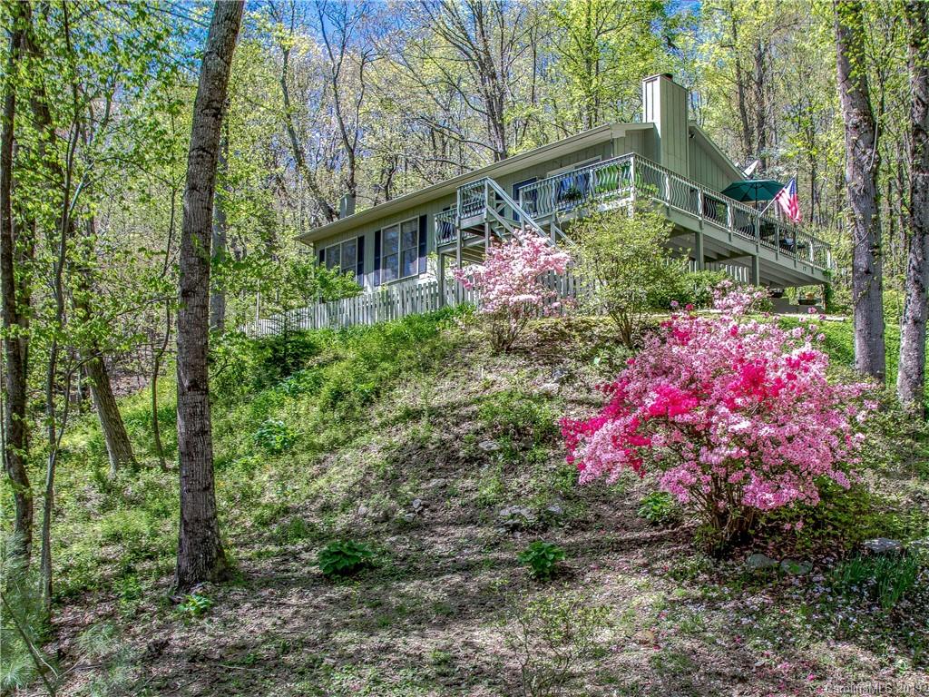 17 Finlay Ridge Road Hendersonville, NC 28739 - Photo 1 of 32 a view of a house with a backyard