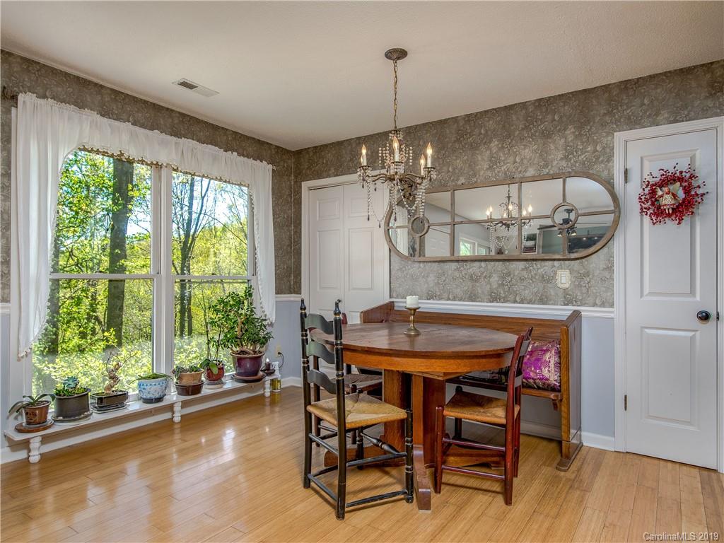 17 Finlay Ridge Road Hendersonville, NC 28739 - Photo 11 of 32 a view of a dining room with furniture window and outside view