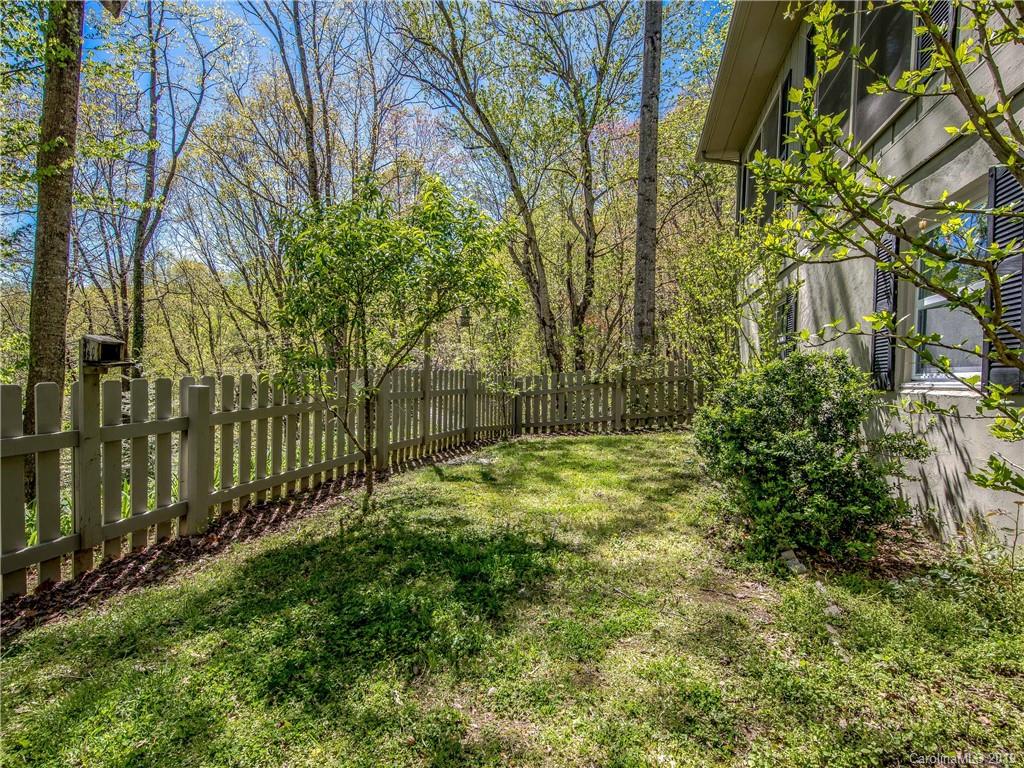 17 Finlay Ridge Road Hendersonville, NC 28739 - Photo 15 of 32 a view of a yard with plants and large trees