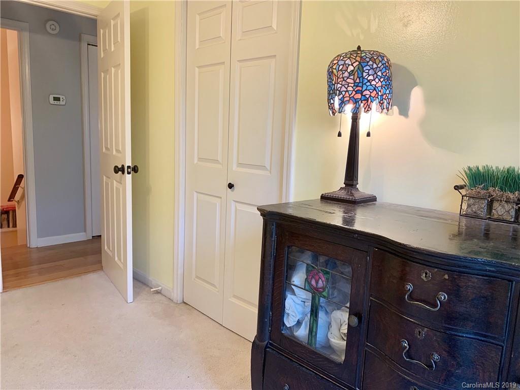 17 Finlay Ridge Road Hendersonville, NC 28739 - Photo 19 of 32 wooden floor with a vase of flowers on it
