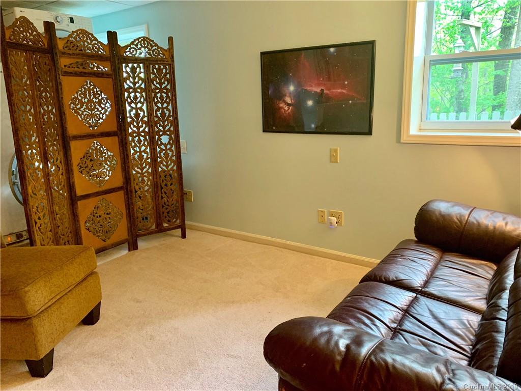 17 Finlay Ridge Road Hendersonville, NC 28739 - Photo 20 of 32 a bedroom with a bed and furniture