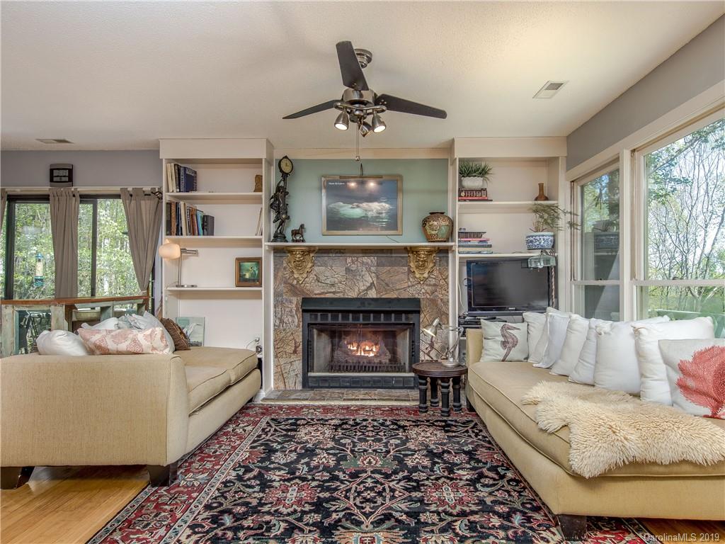 17 Finlay Ridge Road Hendersonville, NC 28739 - Photo 6 of 32 a living room with furniture and a fireplace