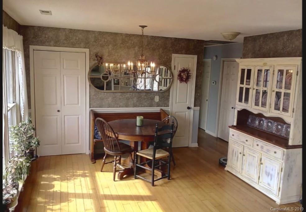 17 Finlay Ridge Road Hendersonville, NC 28739 - Photo 10 of 32 a dining room with furniture and window
